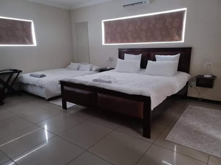 Carlo'S Boutique Guesthouse ولفس بي الغرفة الصورة